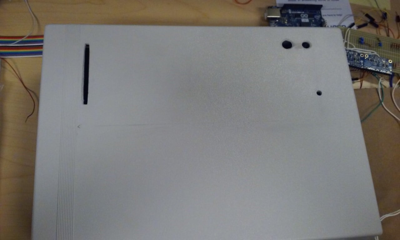 Enclosure lid with peripherals' holes drilled